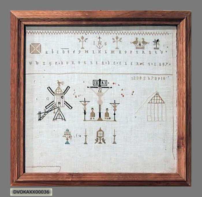 Borduurwerk Christus aan het kruis met staakmolen.