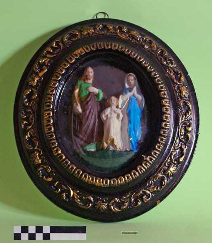 Maria, Jozef en Jezus in kader.