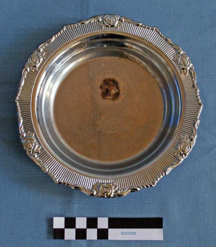 Bord: `60 jaar K.H. Stokkeschutters